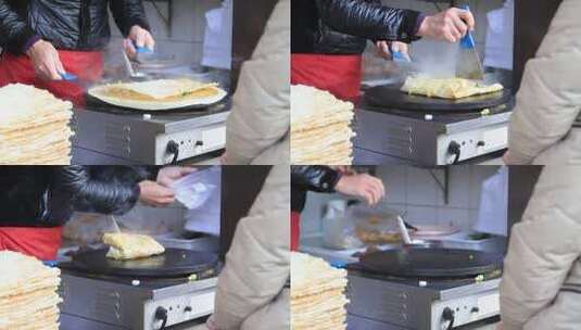 冬天北京护国寺早餐铺煎饼制作过程高清在线视频素材下载