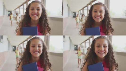 快乐的混血女孩站在学校走廊上的视频高清在线视频素材下载
