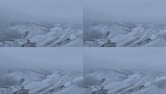航拍风雪交加的山脉田野高清在线视频素材下载