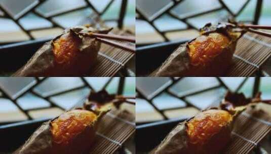 筷子夹起烤红薯 烟薯 糖心蜜薯高清在线视频素材下载