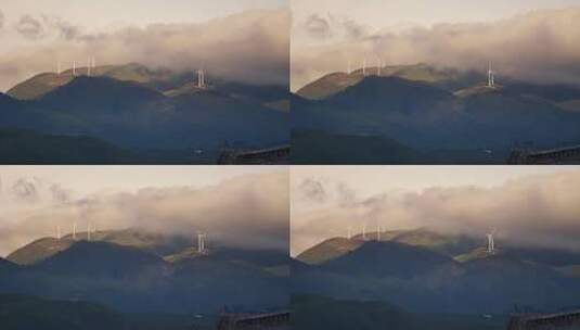 夕阳山顶红色云雾中的风力发电风车高清在线视频素材下载