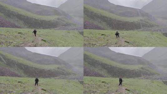 攀登甘孜那玛峰的登山者在冰雹中徒步行进高清在线视频素材下载