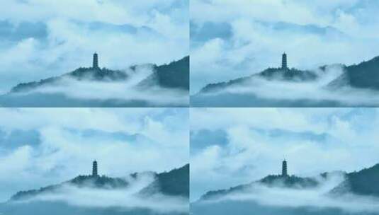 云雾缭绕的山尖宝塔高清在线视频素材下载
