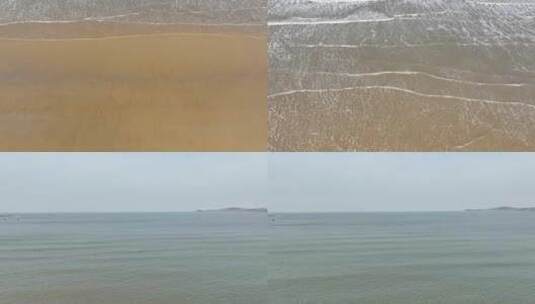 航拍威海金海滩海水浴场的沙滩海浪高清在线视频素材下载