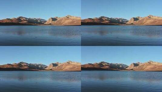 姊妹湖的蓝色湖泊和日照金山高清在线视频素材下载