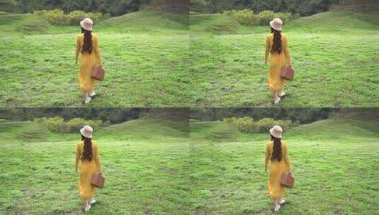 4K少女在草坪上向远处走去视频高清在线视频素材下载