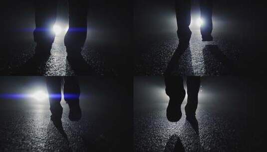 黑暗夜景中一个人走在车灯前高清在线视频素材下载