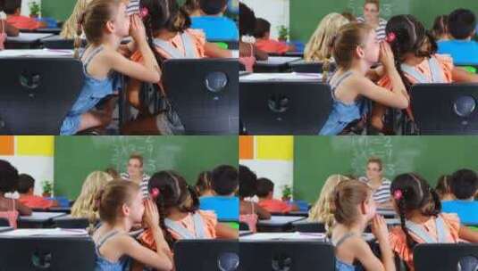 女学生在教室里窃窃私语高清在线视频素材下载