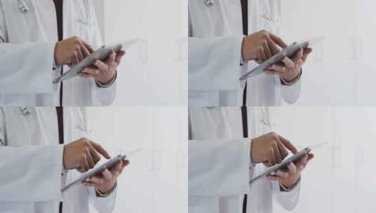 混血男医生使用平板电脑的腹部视频高清在线视频素材下载