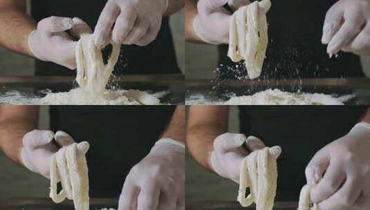 厨师手慢动作准备生鱿鱼环的特写镜头。4K。制作鱿鱼高清在线视频素材下载