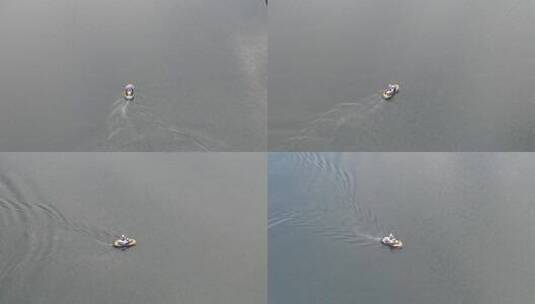在平静的海洋水上与游客一起漂浮的个人船只。空中轨道高清在线视频素材下载