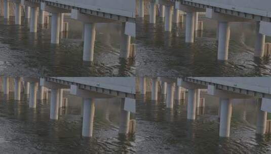 大桥桥墩下河水缓缓流动高清在线视频素材下载