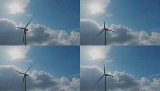 逆光蓝天白云风车风力发电国家电网高清在线视频素材下载