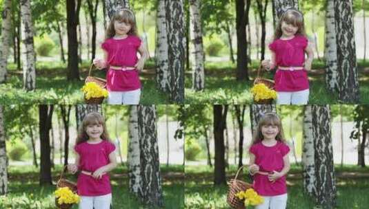 带着一篮子郁金香的女孩站在树林里高清在线视频素材下载