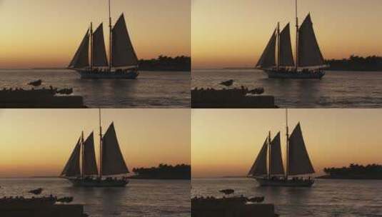 日落时分一艘美丽的帆船高清在线视频素材下载