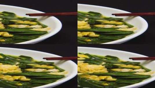 韭菜炒鸡蛋家常菜4k竖版滑轨平移高清在线视频素材下载