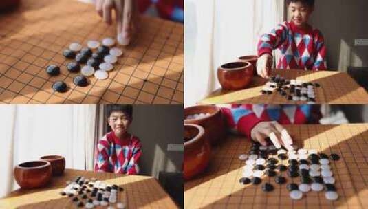 中国小孩在窗边下棋围棋高清在线视频素材下载