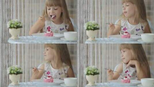 女孩坐在咖啡馆吃蛋糕高清在线视频素材下载
