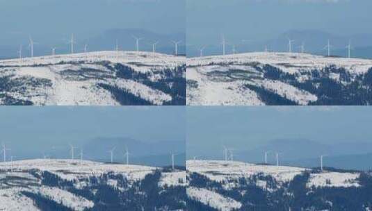 雪山上的风力涡轮机高清在线视频素材下载