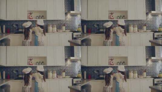 两个小女孩在厨房里刷碗高清在线视频素材下载