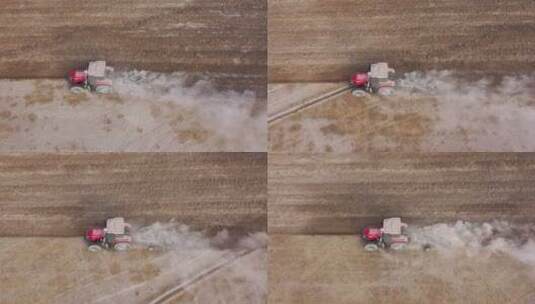 俯拍初冬农民驾驶拖拉机犁地高清在线视频素材下载