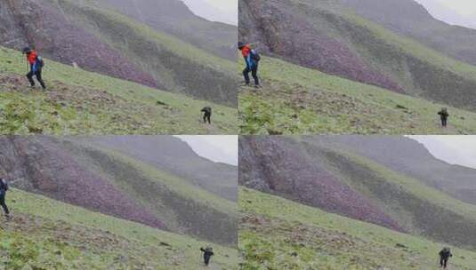 攀登甘孜那玛峰的登山者在冰雹中徒步行进高清在线视频素材下载