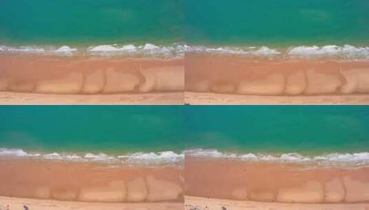 俯拍海浪浪花拍打沙滩高清在线视频素材下载