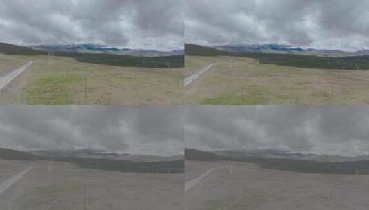 航拍西藏公路旁辽阔的草地高清在线视频素材下载