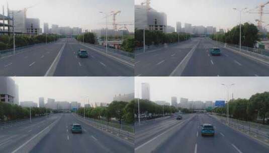 航拍蓝色汽车轿车行驶在城市道路高清在线视频素材下载