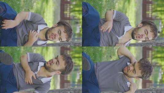 侏儒年轻人在户外呼吸急促的垂直视频。高清在线视频素材下载