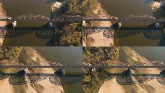 河上的旧铁路桥。无人机飞越旧窄轨铁路的桥高清在线视频素材下载