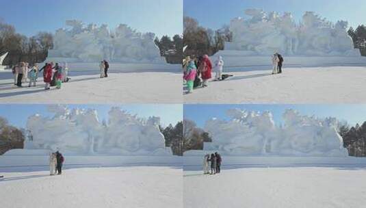 群马八骏图雪雕群像前的游客冰雪雕塑哈尔滨高清在线视频素材下载