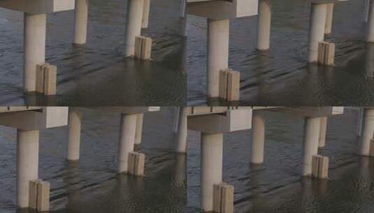 大桥桥墩下河水缓缓流动高清在线视频素材下载