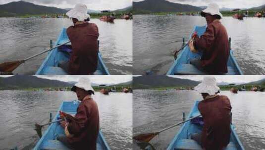 旅游景区：船夫在泸沽湖里泛舟前行高清在线视频素材下载