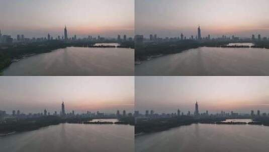 日落时分的江苏南京紫峰大厦玄武湖航拍高清在线视频素材下载