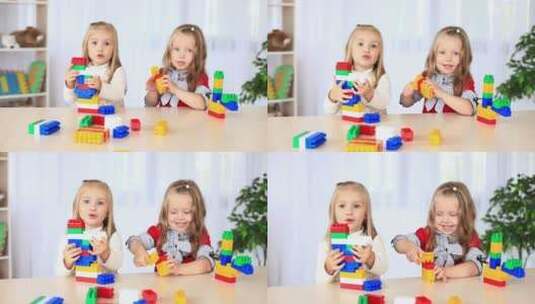两个金发小女孩在玩积木高清在线视频素材下载