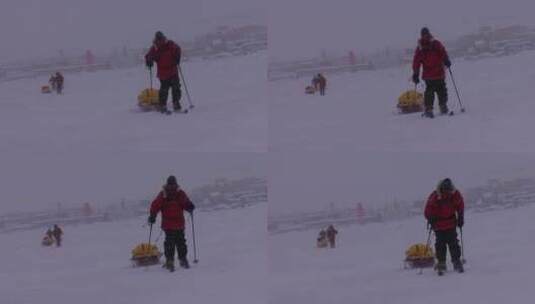 北极探险队在雪地里艰难的前行高清在线视频素材下载