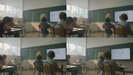 老师在教室里给孩子上课高清在线视频素材下载