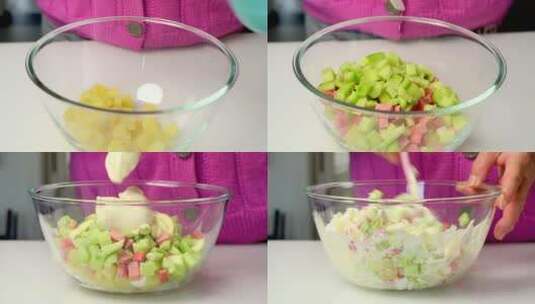 在厨房桌面上搅拌水果沙拉【4K】高清在线视频素材下载