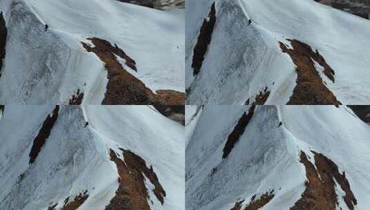 航拍攀登沙鲁里山脉尼登贡嘎雪山的登山者高清在线视频素材下载