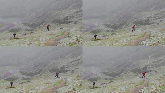 攀登甘孜那玛峰的登山者在冰雹中徒步行进高清在线视频素材下载