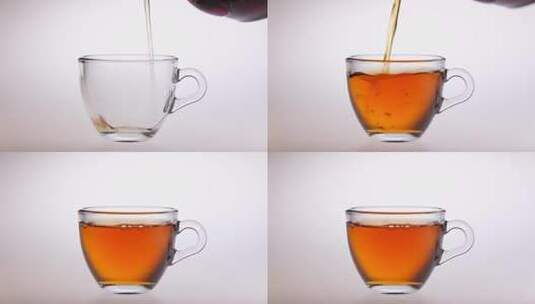 将泡好的茶水倒入透明茶杯高清在线视频素材下载