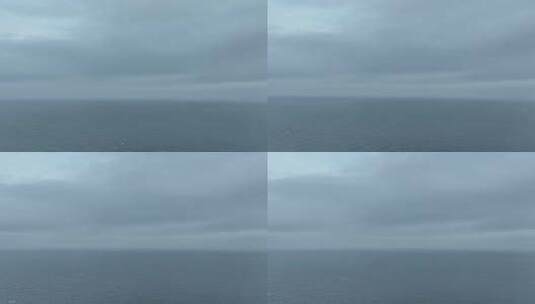 阴天大海航拍海面飞行海平面飞越大海下雨天高清在线视频素材下载