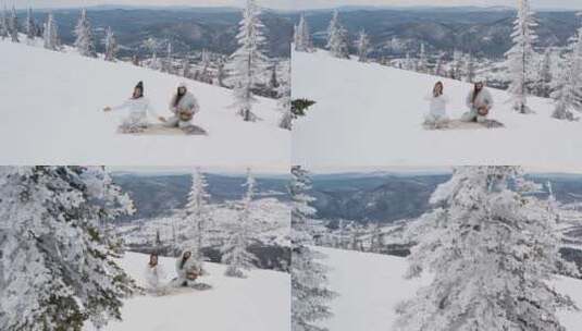 一男一女在雪山上冥想高清在线视频素材下载