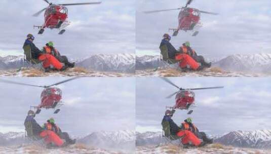 直升机正在给山顶的男子运送物资高清在线视频素材下载