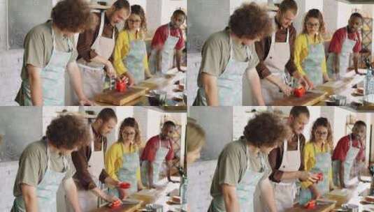 一厨师在教朋友们做烹饪高清在线视频素材下载