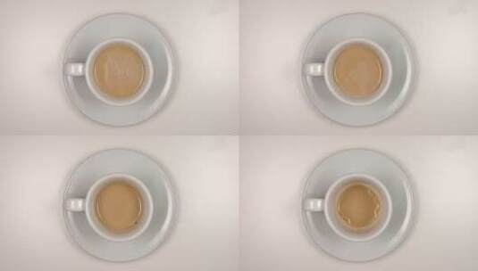 白咖啡杯里的拿铁咖啡定格动画高清在线视频素材下载