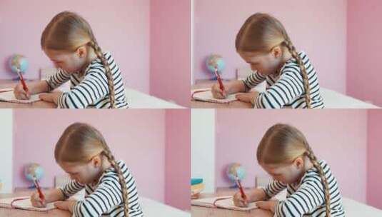 桌子上写作业的女孩高清在线视频素材下载