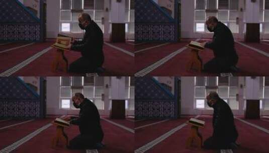 蒙面人在清真寺阅读古兰经高清在线视频素材下载