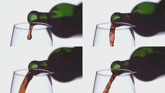 酒瓶中的酒倒入酒杯的慢镜头高清在线视频素材下载